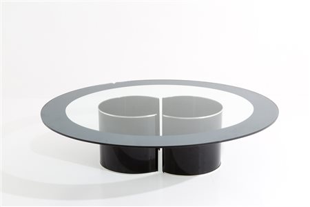 Oval table in enameled steel with glass top. '80s