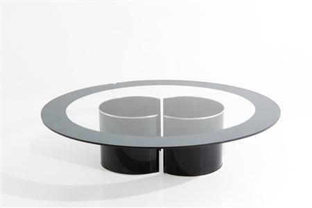 Oval table in enameled steel with glass top. '80s