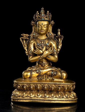 SCULTURA IN BRONZO DORATO CON INTARSI IN PIETRE CON IL BUDDHA VAJRADHARA 
Tibet, XIX secolo