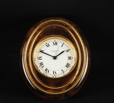 Cartier pendulette Bagnoire di forma ovale in metallo dorato e a finta...