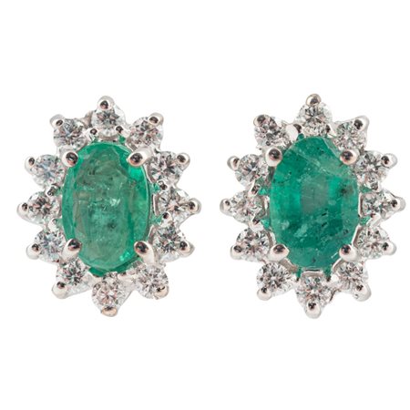 ORECCHINI in oro bianco 18 KT con brillanti e smeraldi