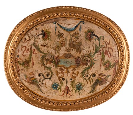 Scuola dell'Italia centrale del XVIII secolo ( - ) 
Mattonella in terracotta dipinta a grottesche 
terracotta dipinta con terre e minerali cm 34x44 ovale