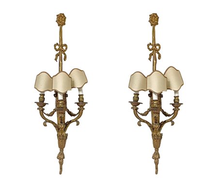Coppia di applique in bronzo dorato a tre luci  h 100 cm, l 
