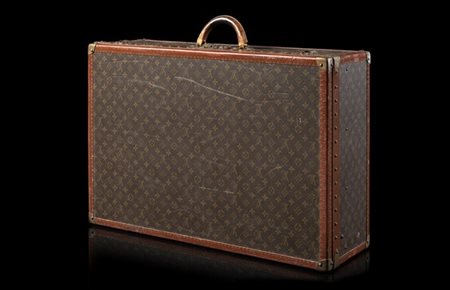 LOUIS VUITTON 
Valigia in tela plastificata Monogram con profili in vacchetta e