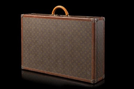 LOUIS VUITTON 
Valigia in tela plastificata Monogram con profili in vacchetta e
