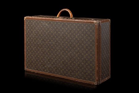 LOUIS VUITTON 
Valigia in tela plastificata Monogram con profili in vacchetta e