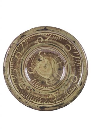 Piattello in lustro dorato con segno di usura nell’umbone
SPAGNA, MANISES; sec. XVII-XVIII.