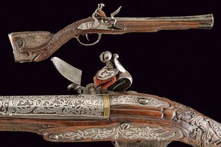 Straordinario tromboncino a pietra focaia decorato in argento