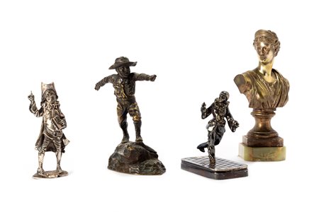 Lotto composto da quattro piccole sculture in metalli diversi, inizi secolo XX