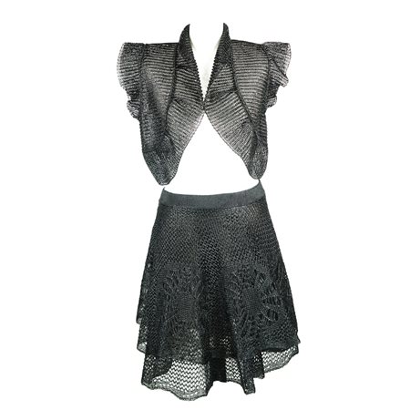 Valentino gonna con bolero in rafia lavorata a rete con motivi floreali; la...