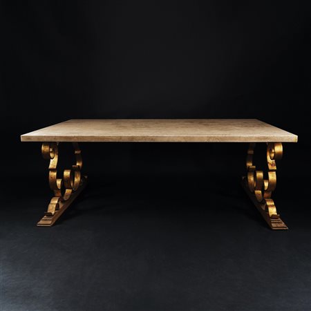 Coppia di tavoli in ferro dorato; montanti a volute stilizzate; piano...