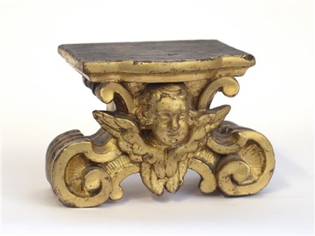 Antica mensola in legno intagliato e dorato a volute e testa di cherubino (cm 2