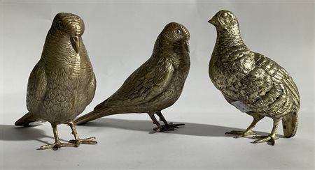 Lotto composto da tre sculture in metallo raffiguranti volatili (difetti)