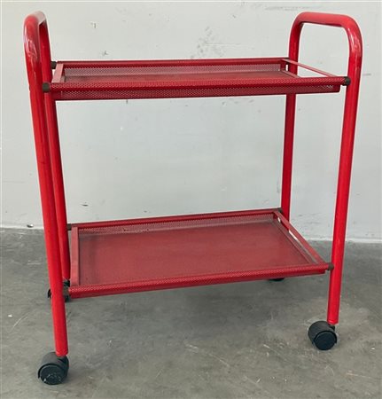 Carrellino in acciaio smaltato rosso a due vassoi asportabili traforati. Italia