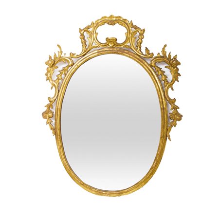 SPECCHIERA di forma ovale con fregi in legno dorato