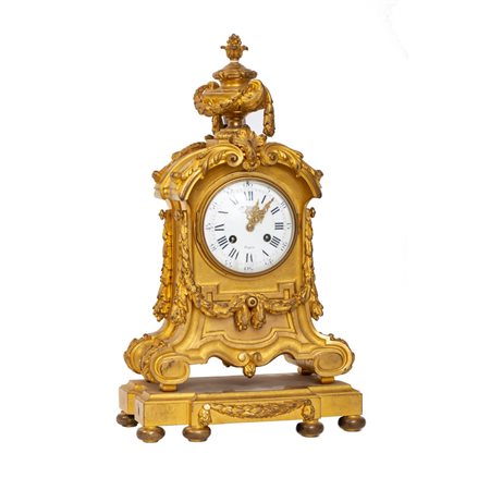 OROLOGIO in bronzo, doratura a mercurio