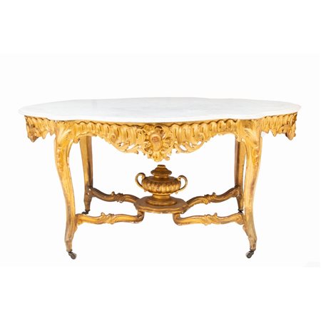 TAVOLO da centro di forma sagomata in legno intagliato