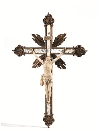 Crocefisso, sec. XIX, in avorio su croce in legno dorato e decorato da...