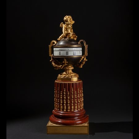 Orologio l'heure tournant in marmo e bronzo dorato, inizi del XIX secolo