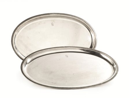Quattro vassoi, in argento, due dei quali ovali e due circolari con bordi...