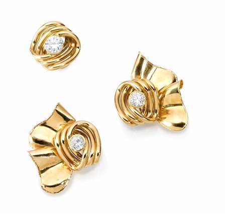 Demi-parure in oro giallo e zirconi composto di paio di orecchini e anellogli...