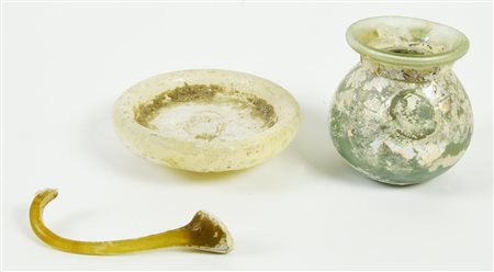 UNGUENTARIO IN VETRO DATAZIONE: II-I sec. a. C. MATERIA E TECNICA: vetro...