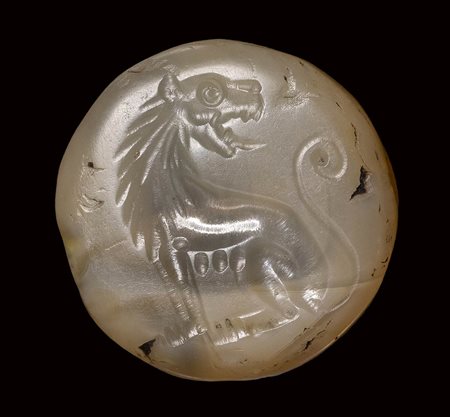 A greek lentoid chalcedony seal intaglio. Lioness. Late 2nd millenium B.C. - Early 1st millenium B.C. 