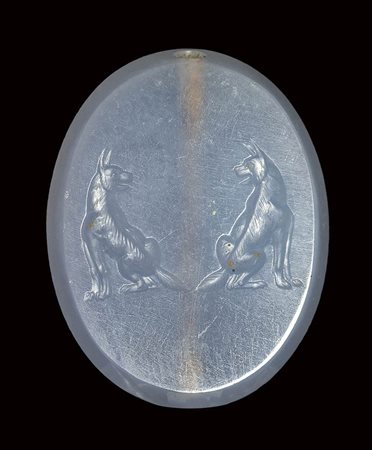 A fine late classical greek blue chalcedony scaraboid seal. Two molossian dogs.5th century B.C.