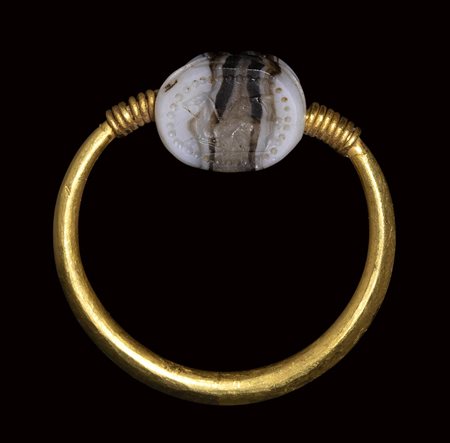 An etruscan banded agate engraved scarab set in a gold swivel ring. Sea-horse. Late 4th century B.C.