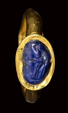 A rare late hellenistic sapphire intaglio set in a later gold ring. Venus at the fountain. 2nd - 1st century B.C.