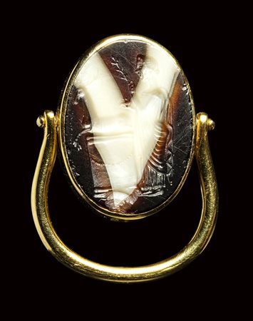 A large roman italic banded agate intaglio set in a swivel gold ring. Sacrifice to Artemis. <br><br>2nd century B.C.