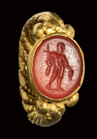 A roman italic carnelian intaglio set in a barbaric gold ring. Perseus <br><br>2nd century B.C. / 5th - 7th century A.D.