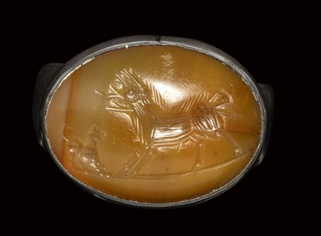 A roman italic agate intaglio set in a silver ring. Boar with a dog. <br><br>2nd century B.C.
