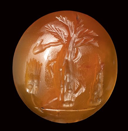 A roman italic carnelian intaglio. Palm tree with attributes.<br><br>1st century B.C.