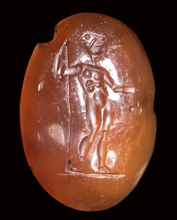 An italic carnelian intaglio. Standing male figure. <br><br>1st century B.C.