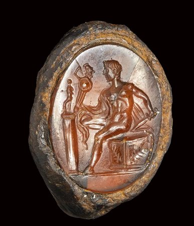 A fine roman carnelian intaglio set in a fragmentary iron ring. Diomedes with Palladium.<br><br>1st century B.C.