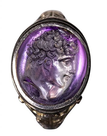 An exceptional greek hellenistic amethyst intaglio set in a late 19th century gold ring. Head of a Youth. Stone : 2nd century B.C.