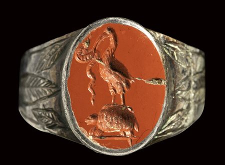 A roman red jasper intaglio mounted on a silver ring. Ibis on a turtle with a snake. <br><br>2nd century A.D. 