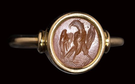 A roman carnelian intaglio set in a gold ring. Eagle. <br><br>2nd - 3rd century A.D.