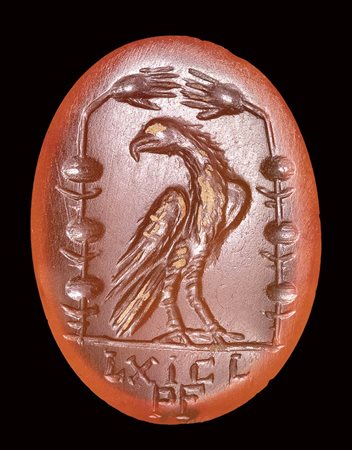 A roman carnelian intaglio. Emblema of victory with eagle and latin letters. <br><br>2nd century A.D. 