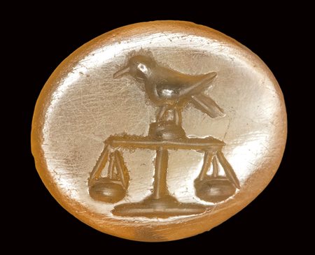 A roman carnelian intaglio.  Bird on a scale. 2nd - 3rd century A.D.