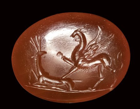 A roman carnelian intaglio. Griffin with deer.<br><br>2nd - 3rd century A.D.