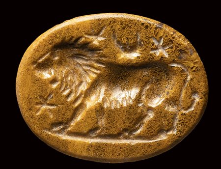 A roman yellow jasper magical intaglio. Lion with moon and stars. <br><br>2nd - 3rd century A.D.