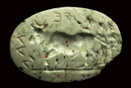 A rare burnt chalcedony intaglio. Ritual procession with Apis.<br><br>1st - 2nd century A.D.