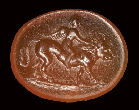 A roman carnelian intaglio. Eros on a lion.<br><br>1st - 2nd century A.D.