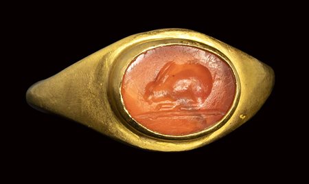 A roman carnelian intaglio set in an ancient gold ring. Rabbit.<br><br>2nd - 3rd century A.D.