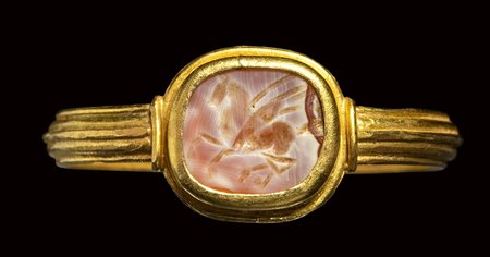 A roman burnt agate intaglio set in a gold ring. Pegasus.<br><br>2nd century A.D.