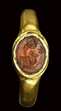 A roman carnelian intaglio set in a gold ring. Allegorical emblema. <br><br>2nd century A.D. 