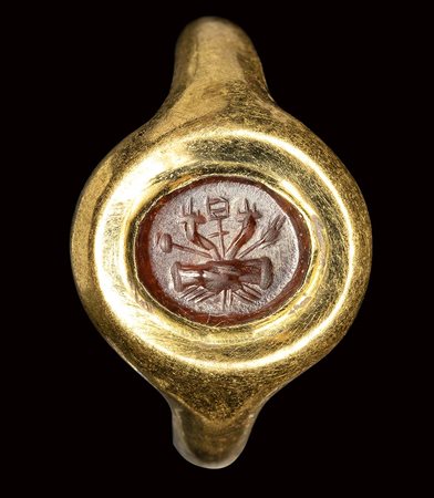 A roman carnelian intaglio set in a gold ring. Dextrarum Junctio.  <br><br>2nd century A.D.