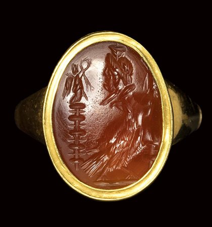 A roman carnelian intaglio set in a gold ring. Allegory of Zeus Sarapis. <br><br>2nd - 3rd century A.D.